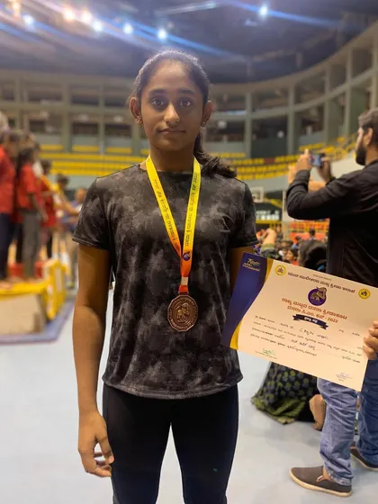 Congratulations to Riya for securing the Bronze medal on the Uneven Bars at the State Dasara sports meet. Your dedication is an inspiration to us all!