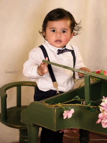 A gallery of our popular school and library theme. These images show the versatility of the brick wall backdrop, mini school desk, globe, and book props for creating a variety of scholarly and classic portraits.