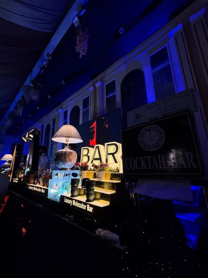 A wide-angle view of the bar, showing how our lighting and decor elements create a cohesive and atmospheric look.