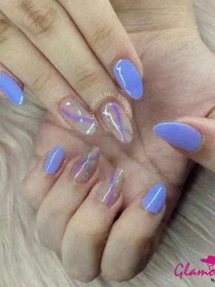 A cool and mysterious design. We used a lovely violet purple for the solid nails and created a smoky, abstract swirl of purple and silver on a transparent base for the accent nails.