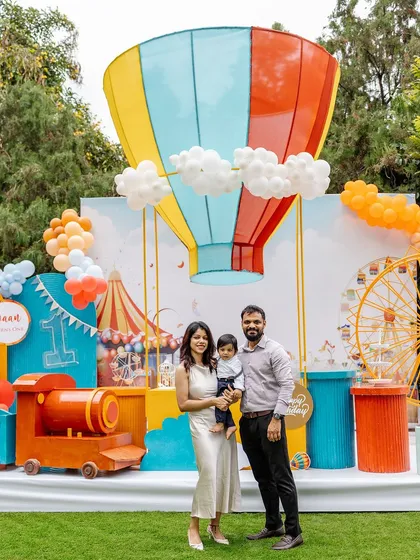 This vibrant carnival-themed first birthday party features a custom hot air balloon backdrop and a miniature train for the kids. It’s a perfect example of how I combine large-scale decorations with interactive elements for a fun-filled day.