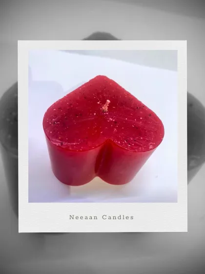 A little heart to light up your day. This simple red heart-shaped candle is hand-poured with love and crafted to charm.