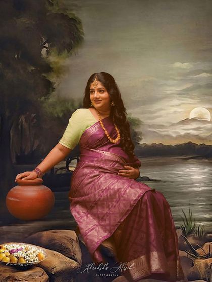 Another masterpiece from the Ravi Varma inspired series. The mother-to-be, seated by a painted moonlit lake, looks like a timeless goddess from a classic painting.