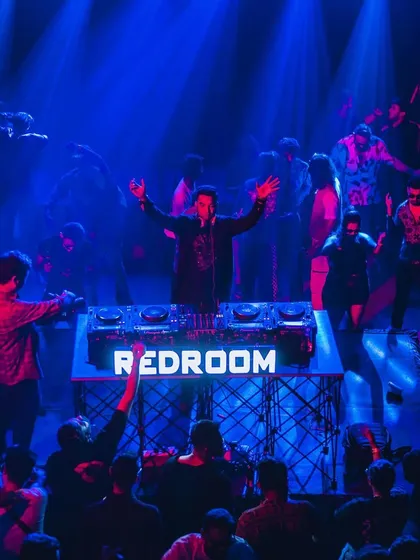 A duplicate shot of the Redroom event, capturing the immersive blue and red lighting.