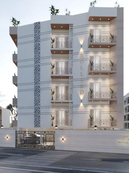 This facade design uses decorative jaali-style panels and varied balcony designs to create a unique and culturally-rooted exterior. The interplay of solid walls and patterned screens adds visual interest and texture.