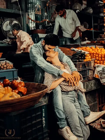 An intimate moment shared amidst the vibrant chaos of a Mumbai flower market. We specialize in finding unique, unconventional locations for pre-wedding shoots that tell a story authentic to you and the city.