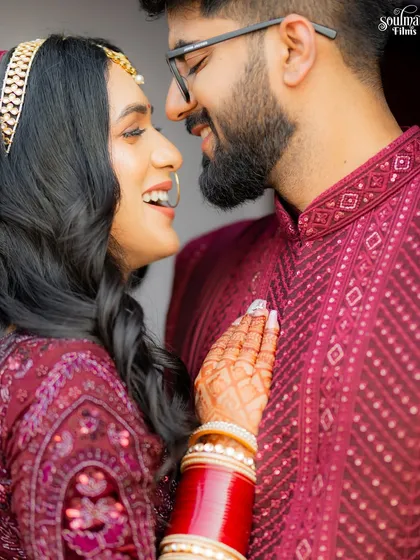 A close-up of the couple sharing a laugh. This candid moment is full of genuine happiness and affection, a perfect representation of their love.