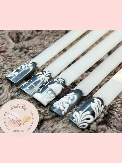 A winter-themed set with elegant white 3D art over a dark, shimmery base, creating a beautiful frosty effect.