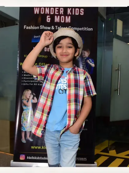 This young man shows off his cool, casual style with a plaid shirt and hat. Auditions are for all kinds of fashion styles.