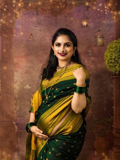 A classic and elegant portrait of an expecting mother. Her confident pose and beautiful smile are perfectly complemented by the traditional attire and festive decor.