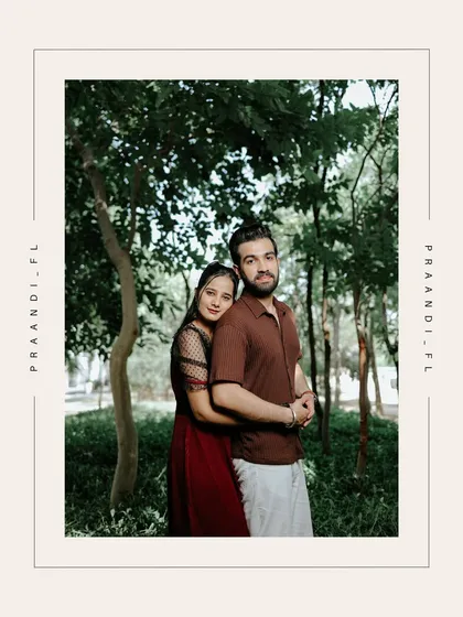 A beautifully framed portrait of the couple embracing in the woods. The clean border gives this image a modern, polished feel while retaining its natural charm.
