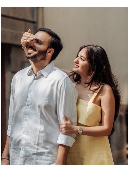 A playful, sun-drenched moment. Her covering his eyes is a perfect example of the unposed, genuine interactions I love to capture.
