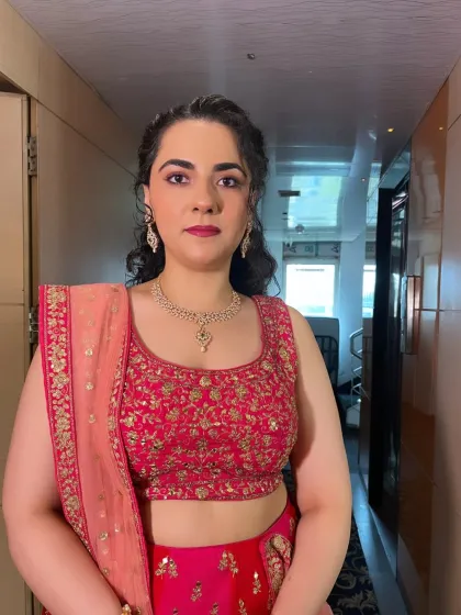 A closer look at the makeup, showing the soft eye makeup and the perfectly matched lip color that completes this beautiful, celebratory look.