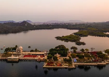 An aerial view of Jagmandir Island Palace in Udaipur, a truly unique and exclusive destination wedding venue. We have the expertise to manage the complex logistics of island and water-access-only locations.