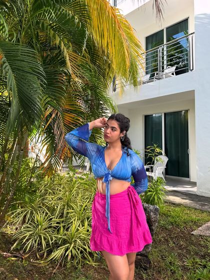 Me and my one brain cell on an island. A fun, self-aware caption paired with a cute photo in a blue tie-dye top and pink skirt, perfect for a beach vacation.