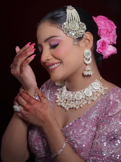 A candid moment capturing the bride's happiness and the elegance of her complete look.