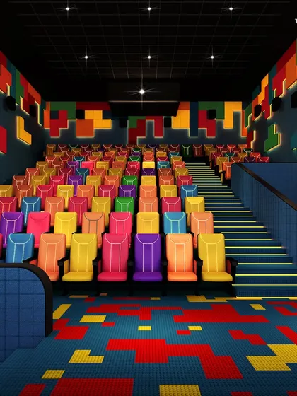 A playful and vibrant private cinema designed for kids. The space features colorful, block-like seating and a Tetris-inspired design on the walls and carpet, creating a fun and engaging environment for younger audiences.