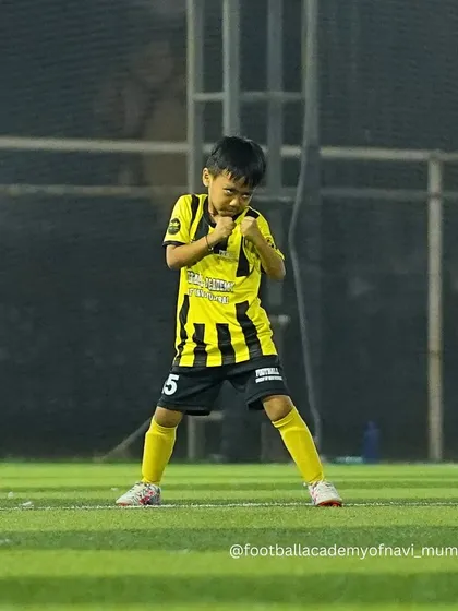 A young player shows his fighting spirit and determination on the field.