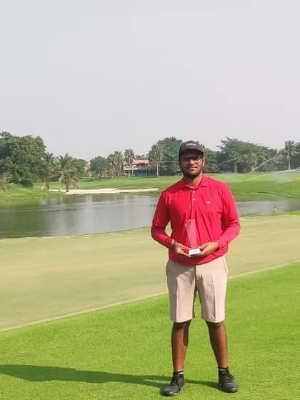 A portrait of victory. Harman Sachdeva stands proudly on the course after his impressive win at the IGU Gujarat Open.