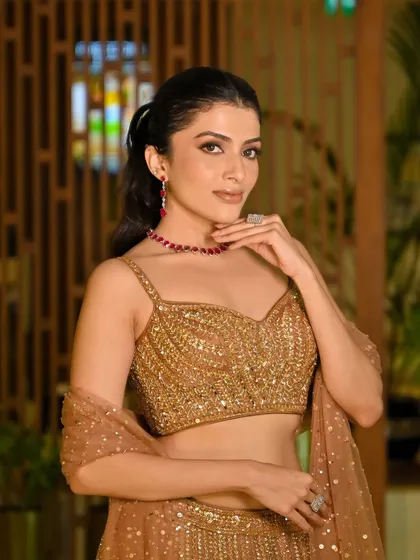 A classic smokey eye paired with a nude lip is a timeless combination for a sangeet night. I created this look to be dramatic yet elegant, perfect for a night of celebration.