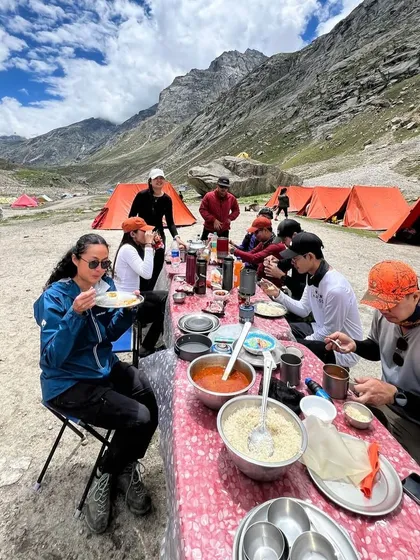 Mealtime with a view! Enjoying a hot and delicious meal at our high-altitude campsite in Balu ka Ghera.