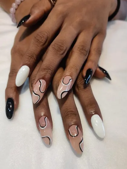 Another angle of this modern black and white abstract set. It's a versatile design that looks great on any nail shape.