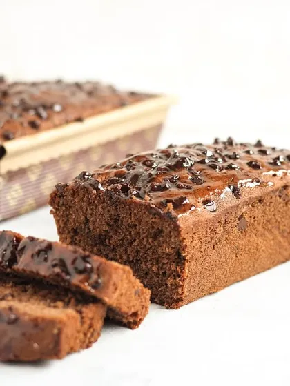 Our classic Chocolate Chip Tea Cake, a simple loaf perfect for any time of day. Sliced to show its moist crumb and generous chocolate chips, it’s the ultimate comfort bake.