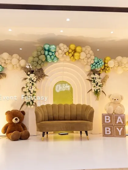 This modern and chic baby shower for Twinkle features a gentle, earthy color palette. I used organic balloon garlands, cute teddy bears, and a stylish scalloped sofa to create a warm, inviting, and picture-perfect space for the celebration.