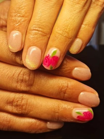 A delicate and romantic design with a single hand-painted pink rose on a shimmery nude base.