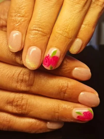 A delicate and romantic design with a single hand-painted pink rose on a shimmery nude base.