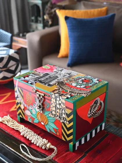 This Banjara-themed accent trunk is a riot of color and texture. I used oversized Afghan and Tibetan jewelry motifs, vintage portraits, and bold geometric patterns to create a dramatic tabletop piece.