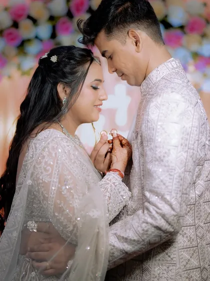 I love capturing the soft, romantic moments just for the two of you. Here, the couple shares a quiet look, framed by the beautiful floral decor, showing the modern and elegant side of engagement photography.