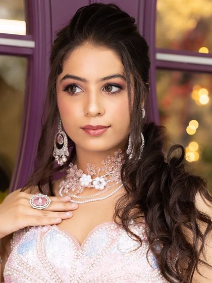 A series of portraits from an engagement shoot, featuring a model in a pink lehenga and modern jewellery. This is a great reference for a soft, romantic look.
