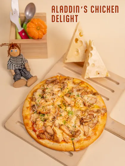 Pizza time! Our Aladdin's Chicken Delight pizza is a magical treat for our little guests, with a cheesy topping and kid-friendly flavors.