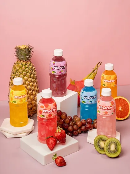 A vibrant group shot showcasing a full range of flavored drinks. I carefully style multiple products with fresh fruit to highlight each flavor, creating a colorful and refreshing image for a summer campaign.