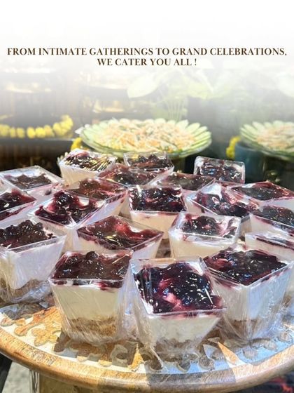 From intimate gatherings to grand celebrations, we cater to all. This shot focuses on our beautifully presented individual dessert cups, a perfect sweet ending to a lavish buffet meal.