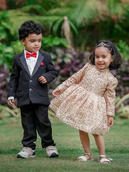 A dapper little gentleman and a sparkling little lady make an adorable pair. We love capturing kids in their finest outfits for special occasion photoshoots.