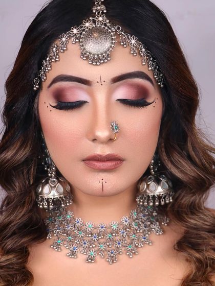 A serene, eyes-closed shot to showcase the beautifully blended smokey eyeshadow that is the heart of this look.