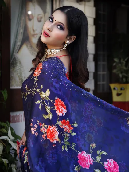 This deep blue floral saree is a sophisticated choice for a cocktail party or wedding reception. I paired it with a simple choker to let the bold print and flowing fabric be the main focus.