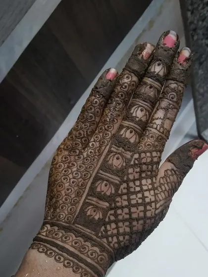 This is a student's practice piece with the henna paste still on. Learning how to fill patterns cleanly and create consistent textures is a core part of my curriculum.