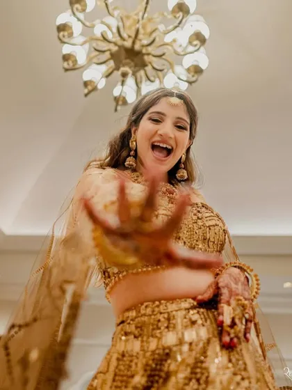 The bride letting her hair down and owning the dance floor. Our job is to create a space where she can celebrate freely.