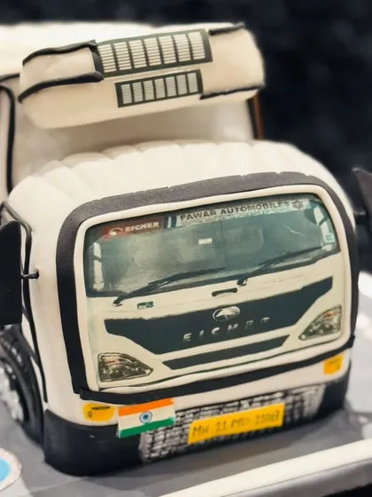 This realistic Eicher truck cake was a special project to honour a business owner. I recreated the vehicle with precise detail, from the company logo and license plate down to the texture of the tires, all in edible form.