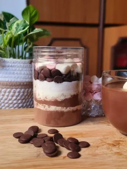 A close-up of the layers in my Hot Cocoa Drink Mix jar. I use high-quality cocoa and chocolate chips to ensure every cup is deeply flavourful and satisfying.
