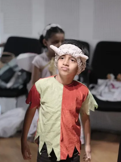 A moment of focus and concentration from a young actor just before making his entrance.