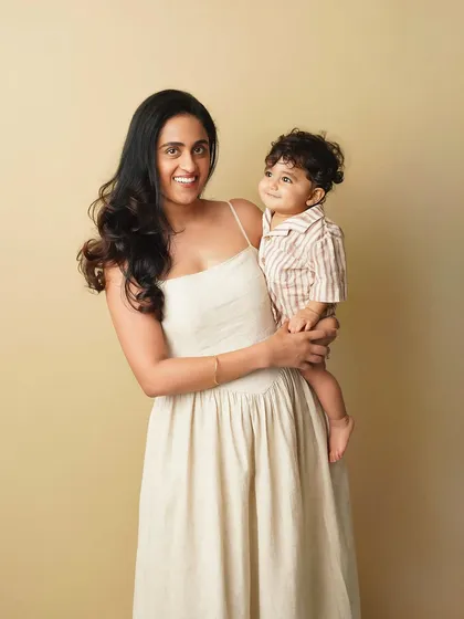 A beautiful mother and son portrait. Her smile and his sweet gaze towards her create a truly special connection in the photo.