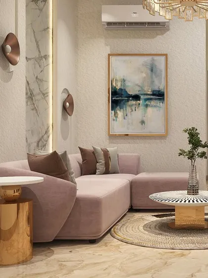 A different view of the pink lounge, highlighting the sleek golden side table and abstract wall art. This space is a perfect example of how we use color and texture to create a unique and expressive interior.