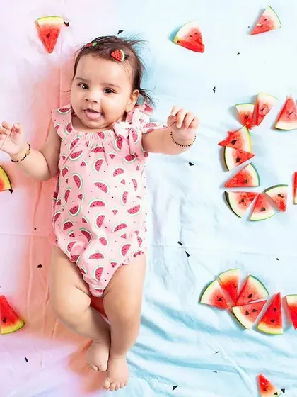 Here, a dual-tone backdrop of pink and blue was used to create a distinct look for this baby milestone photo. The seamless paper rolls allow for clean, professional results for any creative concept you have in mind.