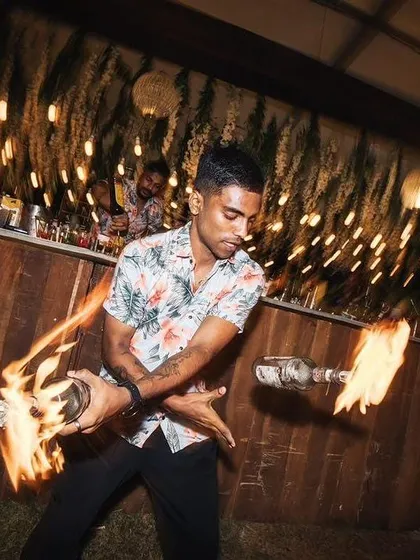 Capturing the motion and energy of a fire flair routine. Our bartenders are masters of performance, adding a thrilling visual element to their mixology skills.