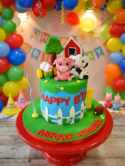 I love bringing imaginative worlds to life, like this vibrant barnyard-themed cake for a child's birthday. Every detail, from the hand-sculpted farm animals and red barn to the tiny picket fence, is crafted from edible fondant, making it a playful and delicious centerpiece.