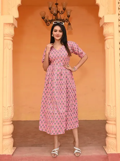 My traditional Bagru hand-block printed cotton dress in a lovely pink. This one-piece dress features charming puff sleeves and is made from breathable 60*60 pure cotton, ensuring both comfort and style.